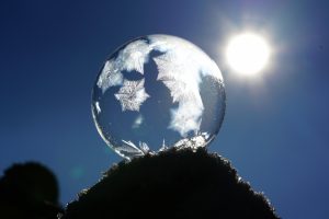 crystal ball with snow and sun