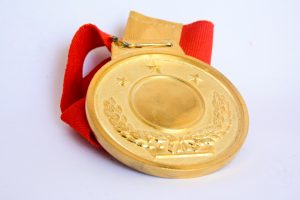 medal or badge with red ribbon